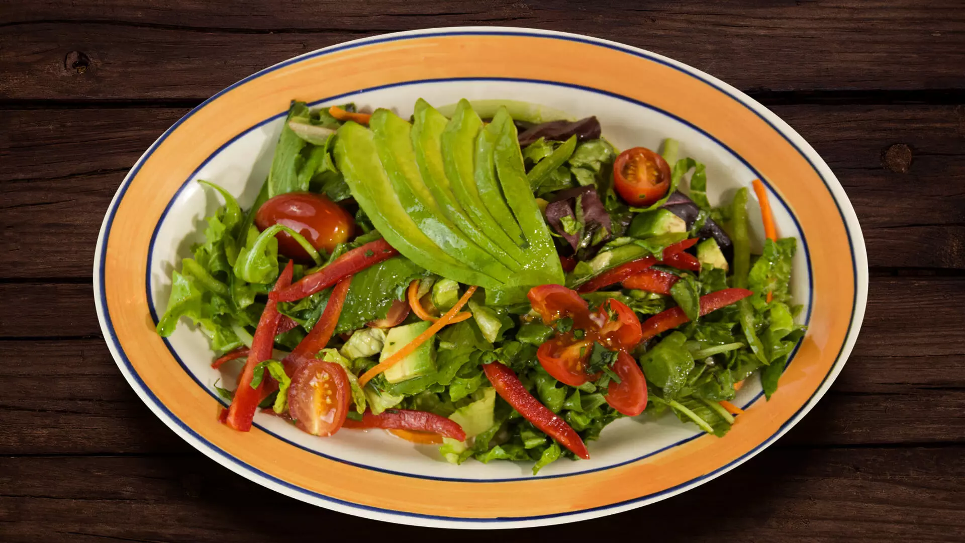 Avocado salad dish on wooden table