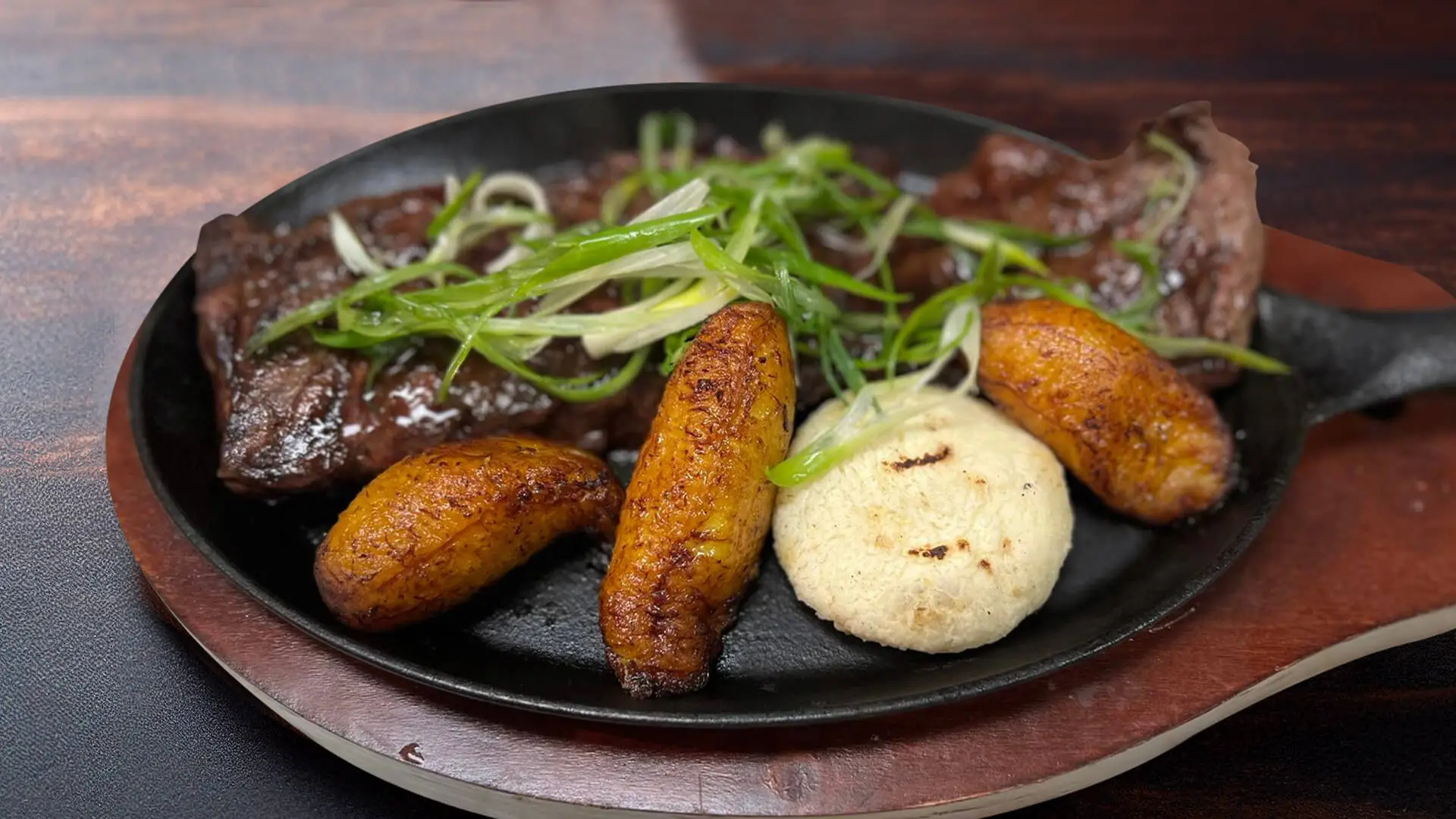 Grilled beef entrails on wooden table