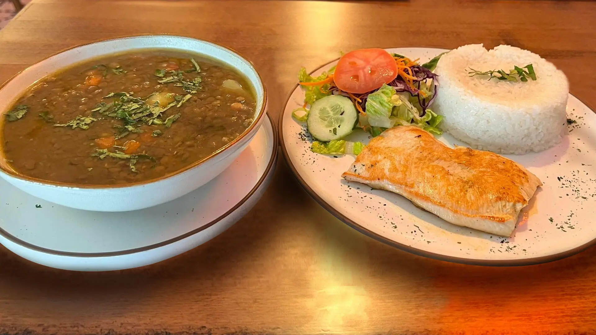 Dish with lentils, rice, meat and salad