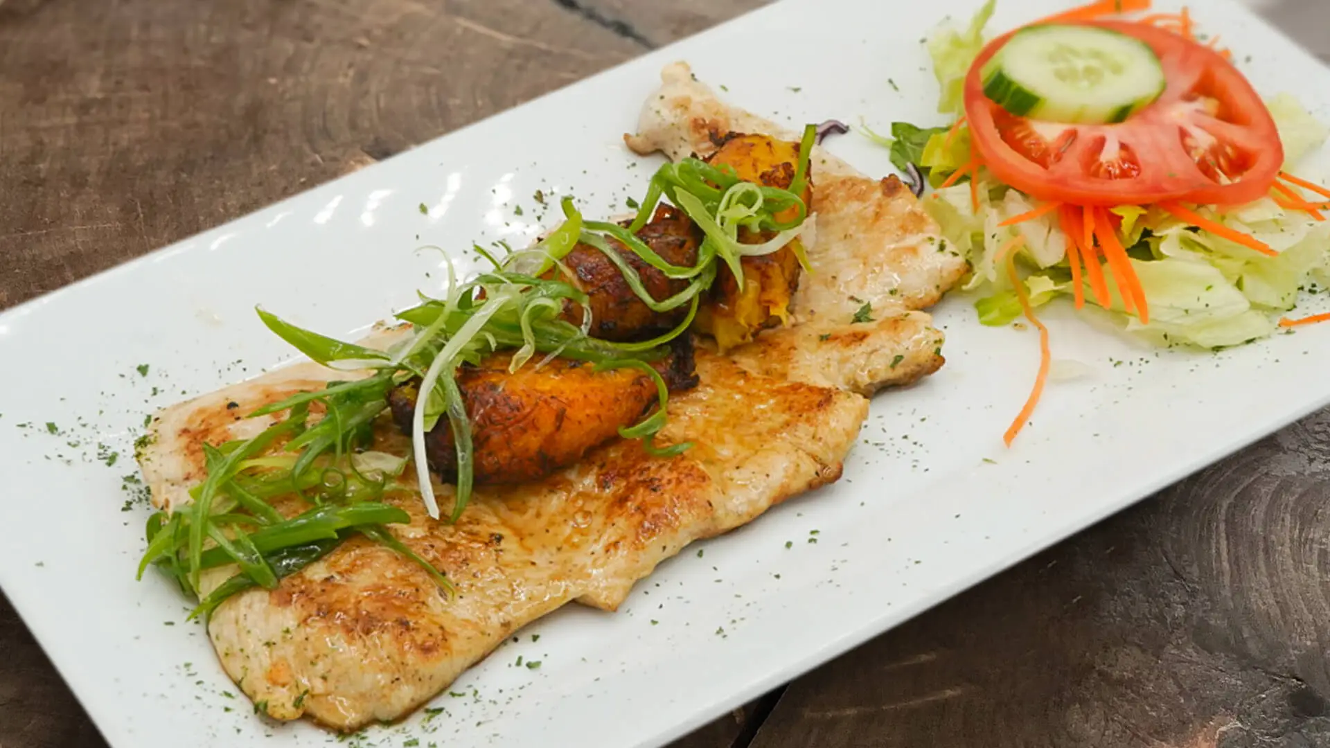 Chicken Breast in Lemon Cream on dark wooden table