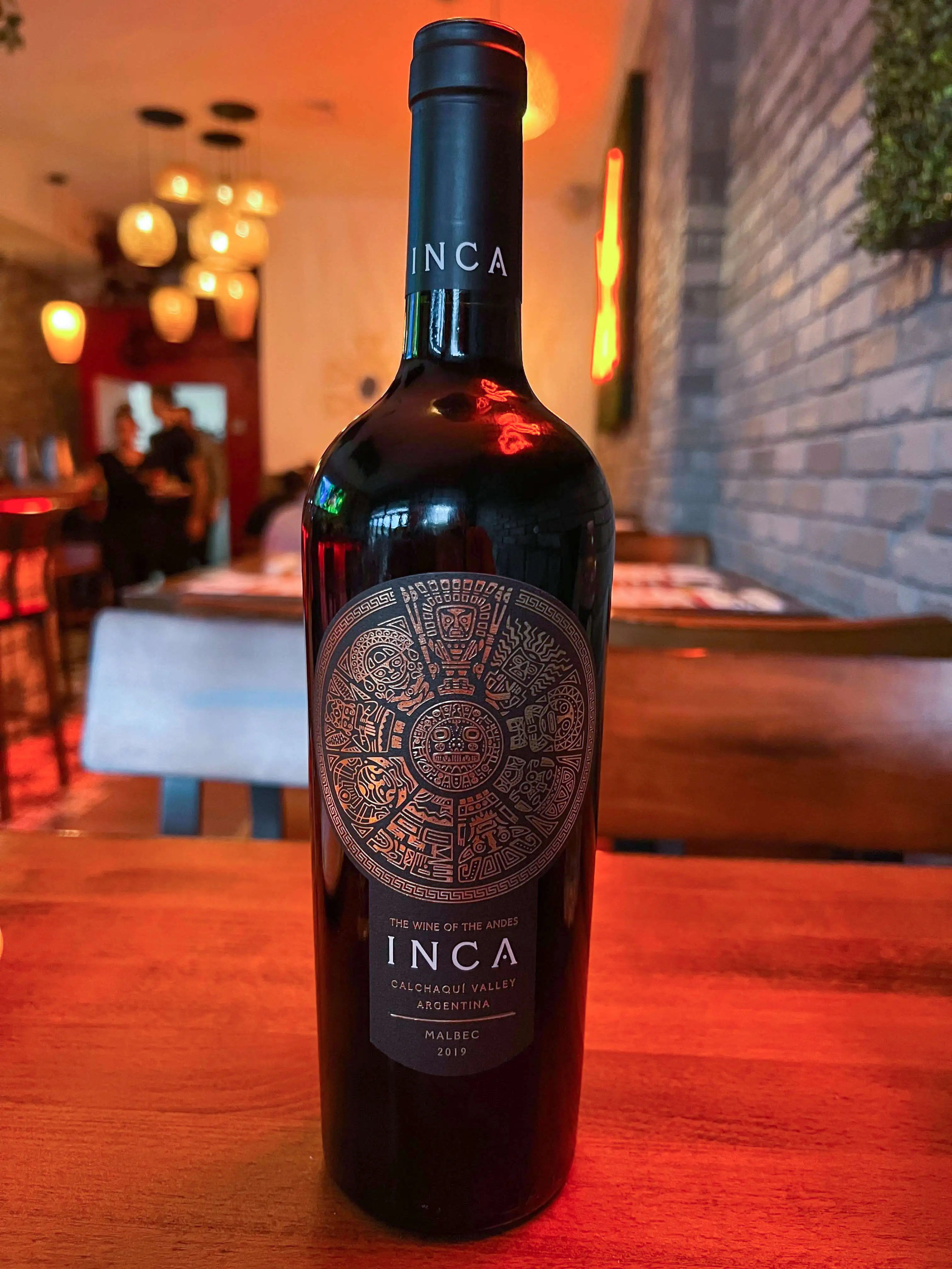 Inca wine bottle on inca paisa restaurant table